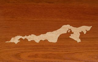 Custom Curly Maple inlay of an island off the east coast set into a Face Grain Jatoba island top.