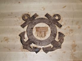 A Coast Guard inlay being set with epoxy