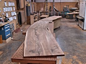 Working on an 18' long book-matched TX Walnut bar top with Wane Edges