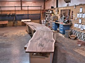 Working on an 18' long book-matched TX Walnut bar top with Wane Edges