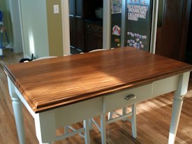 Afromosia edge grain custom wood table top.