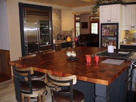 Mesquite parquet-style end grain island countertop with Stainless Steel Grids and Tung-oil finish. 