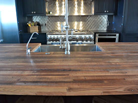 Reclaimed Truckbed Flooring edge grain wood island countertop with Tung-Oil finish.