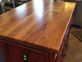 Tx Pecan face grain custom wood island countertop with Waterlox Satin Finish.