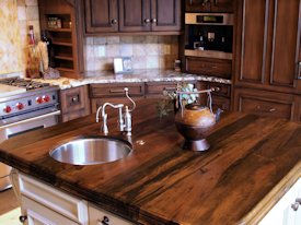Texas Pecan book matched slab wood island top with Natural Edges and an integrated Texas Pecan Sink.  Waterlox Satin finish.