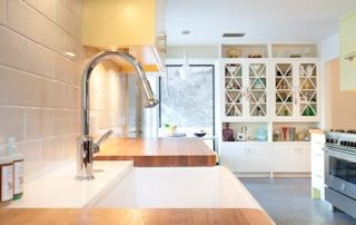 Edge Grain White Oak countertop with farm sink and Waterlox finish